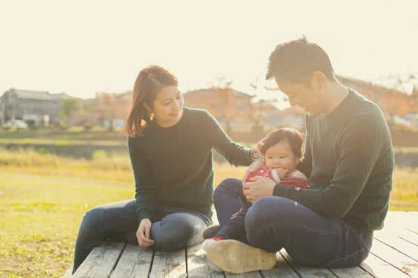 Mom and dad holding baby